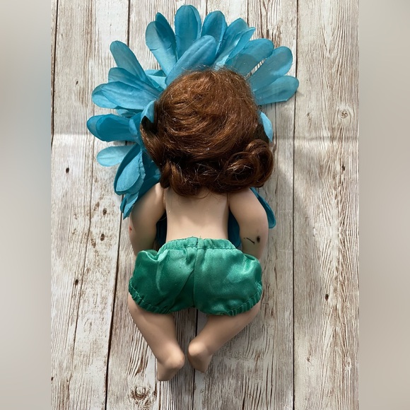 Collectible Porcelain Baby Doll Dressed in a Blue & Yellow Flower Costume - Picture 5 of 10